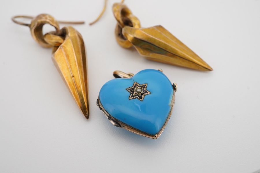 A pair of Victorian yellow metal drop earrings, 32mm excluding ear wire, together with a blue enamel and seed pearl set heart shaped locket(chip). Condition - poor